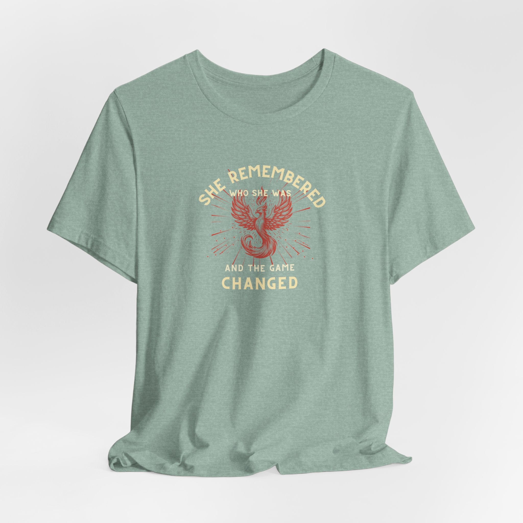 Women's Motivational Quote Tee - Red Phoenix by Doctor T-shirt Studio featuring a red phoenix graphic on a Mint shirt, symbolizing strength and inspiration.