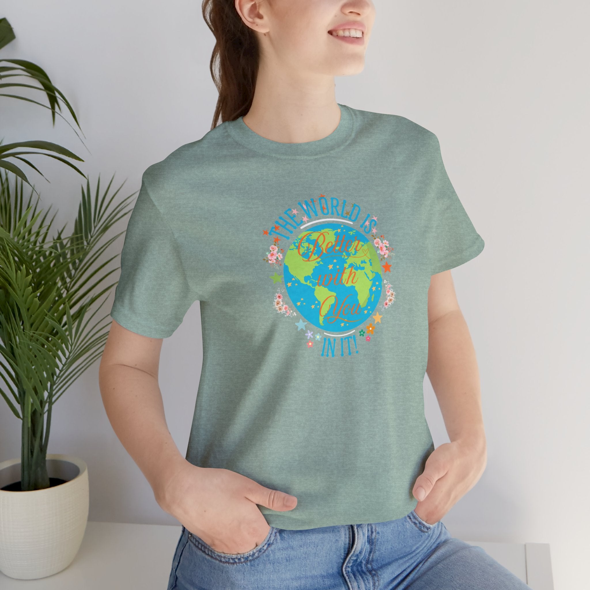 Inspirational Women's Tee with Flowers and Stars by Doctor T-Shirt Studio, featuring a woman in a green shirt with a cursive quote and floral design.