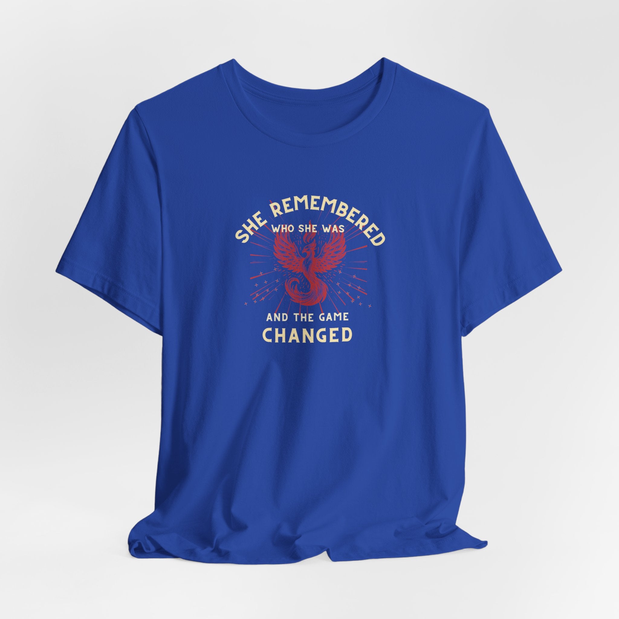 Women's Motivational Quote Tee - Red Phoenix by Doctor T-shirt Studio featuring a red phoenix graphic on a blue shirt, symbolizing strength and inspiration.