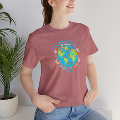 Inspirational Women's Tee with Flowers and Stars by Doctor T-Shirt Studio, featuring a woman in a red shirt with a cursive quote and floral design.