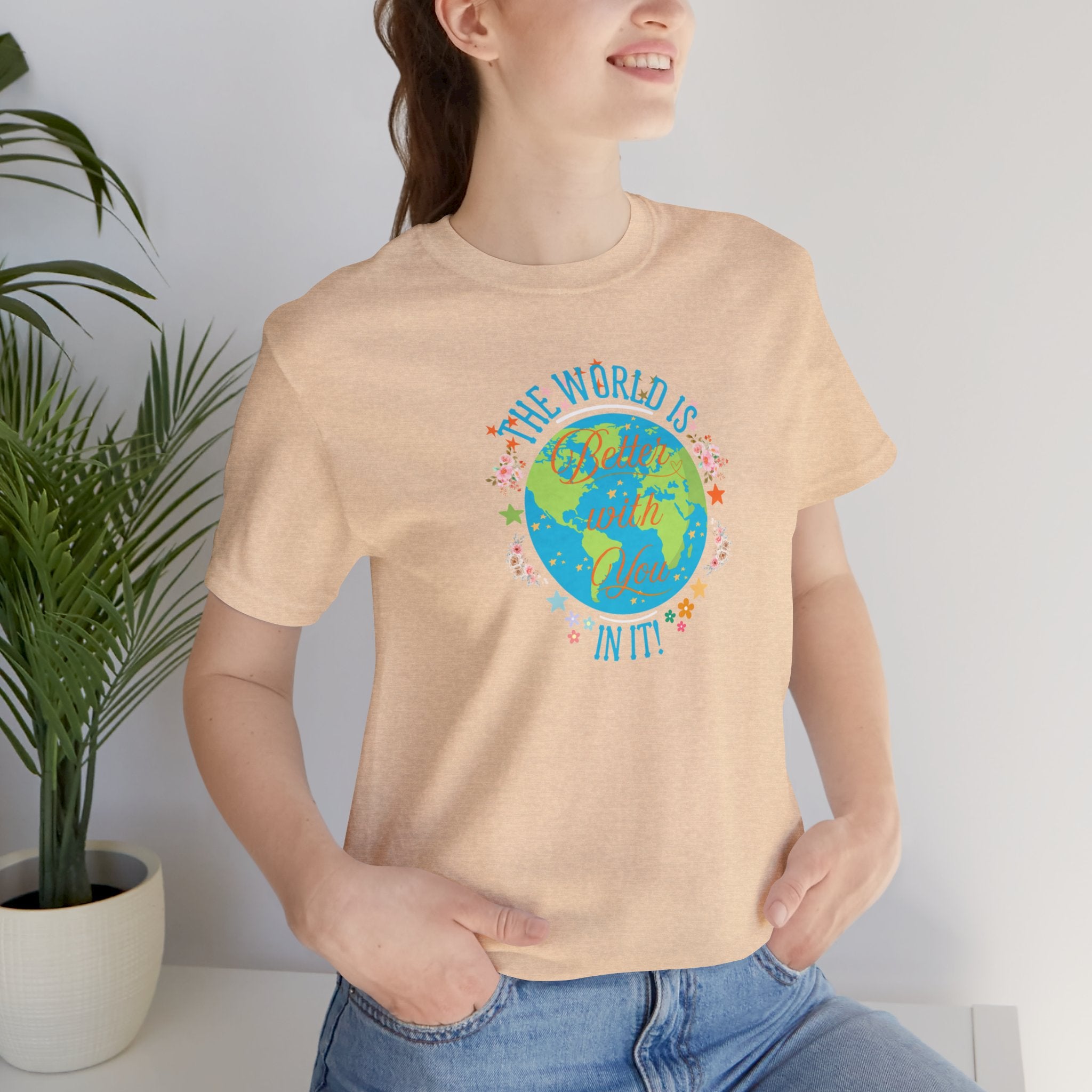 Inspirational Women's Tee with Flowers and Stars by Doctor T-Shirt Studio, featuring a woman in a cream shirt with a cursive quote and floral design.