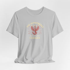 Women's Motivational Quote Tee - Red Phoenix by Doctor T-shirt Studio featuring a red phoenix graphic on a grey shirt, symbolizing strength and inspiration.