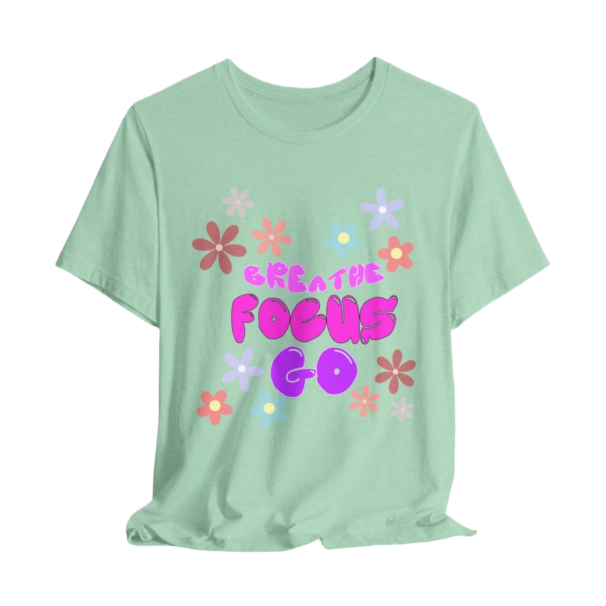 Surrounded by colorful flowers, "Breathe, Focus, Go" in different colors of pink and one puple. on heather mint shitrt